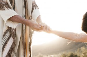 Jesus taking someone's hand