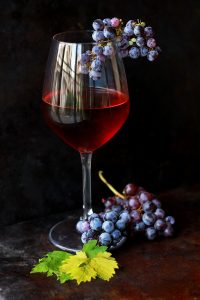 Wine glass with grapes. Photo by Roberta Sorge on Unsplash.com