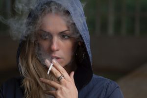 Woman smoking via Stas Svechnikov on Unsplash